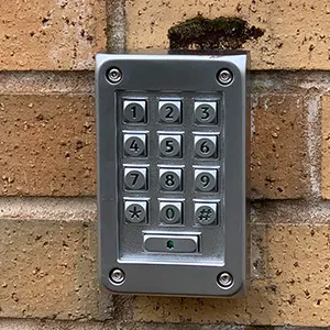 a close up of a door handle on a brick wall